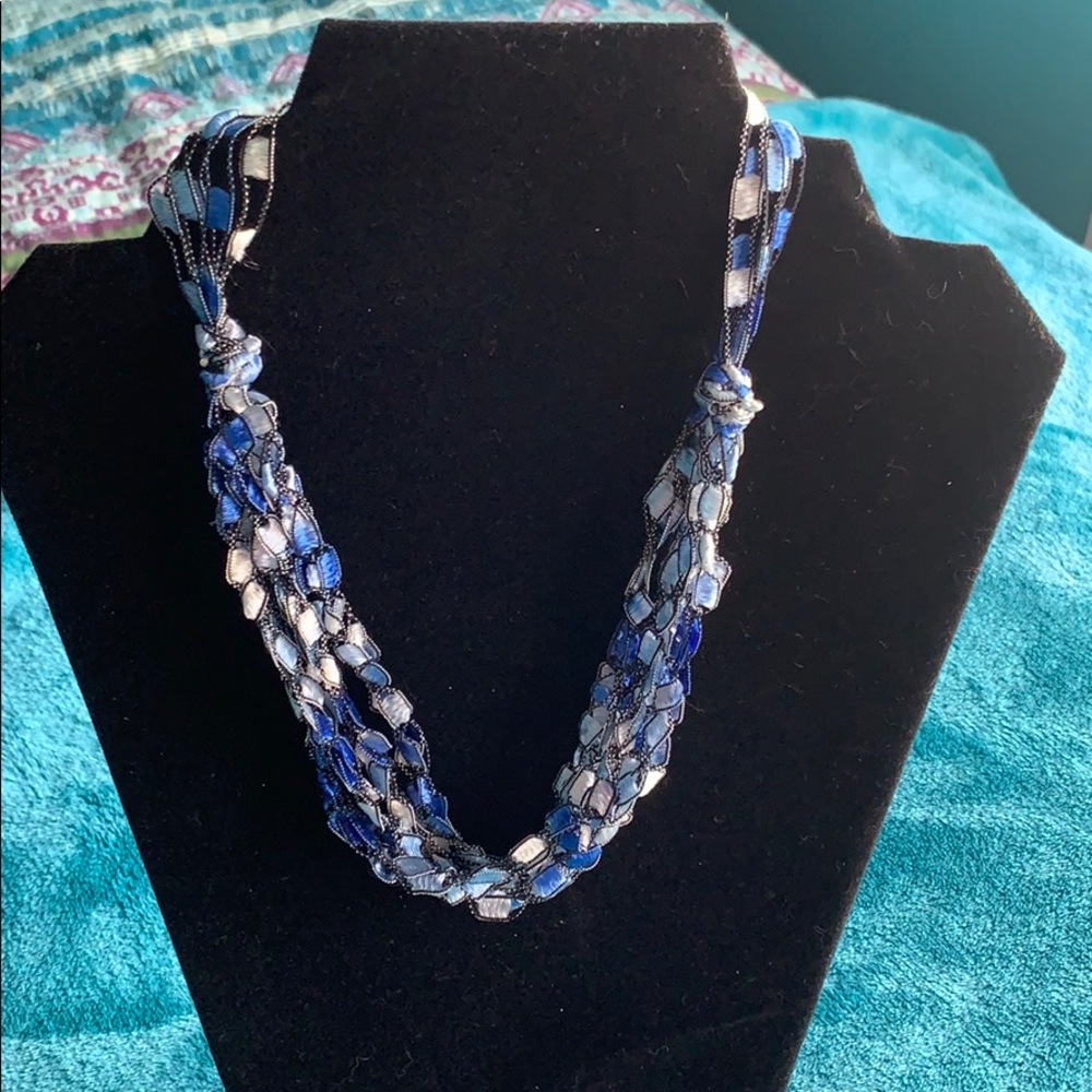 Multi strand fabric necklace.